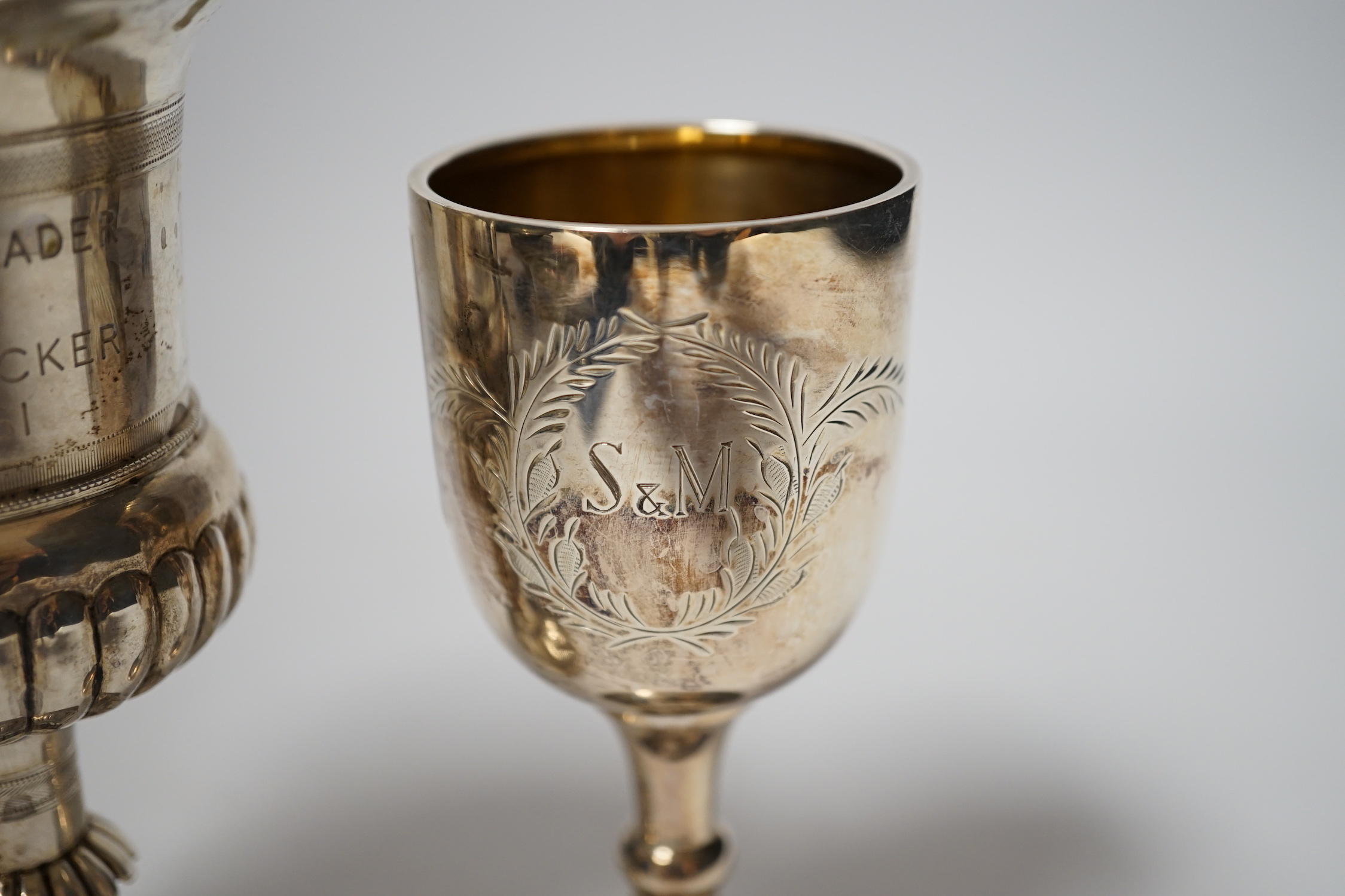A small modern silver goblet, 11.2cm. and one other larger white metal goblet.
